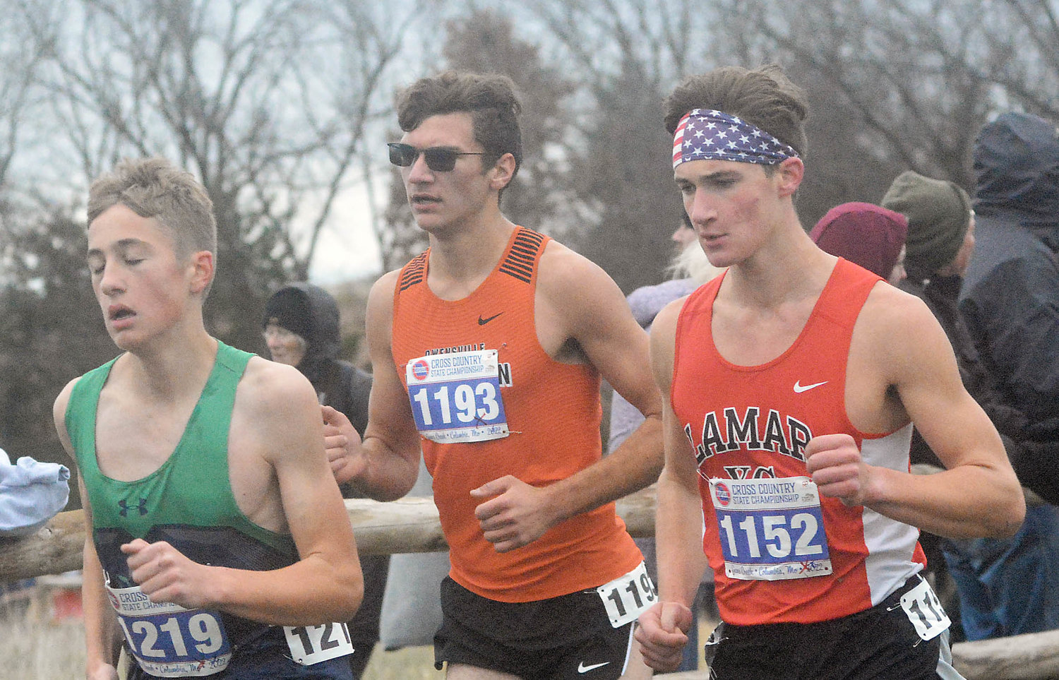Felix Guerrero (center) competes in the Class 3 Boys Race with St. Michael the Archangel’s David Rogge in front of him and Lamar’s Blaine Breshears beside him.